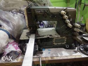Gray Embroiderer Sewing Machine