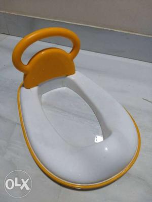Orange and White potty seat. Applicable for