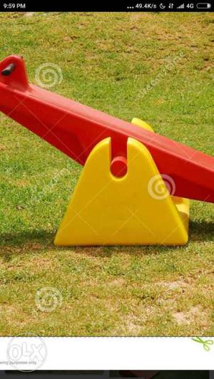 Red And Yellow Plastic See Saw