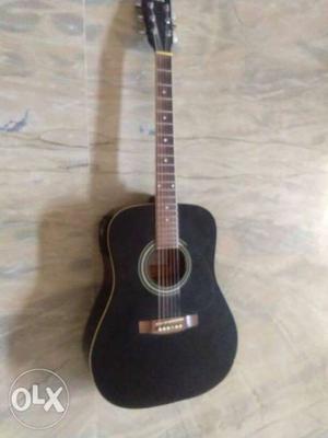Right handed acoustic guitar with tuner and with