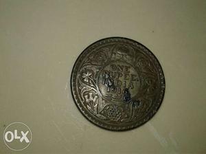 Round  Silver-colored One Rupee India Coin