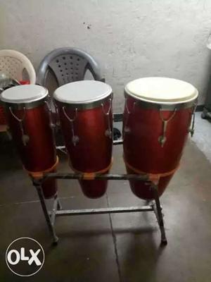 Three Brown-and-white Congo Drums in good condition
