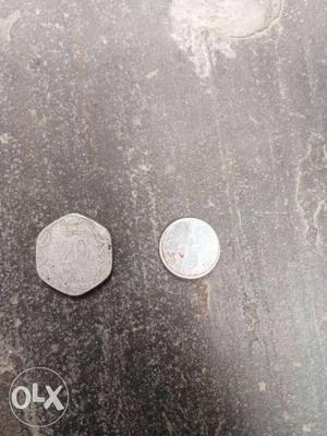 Two Hexagonal And Round Silver-colored Coins