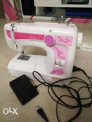 White And Pink Corded Sewing Machine