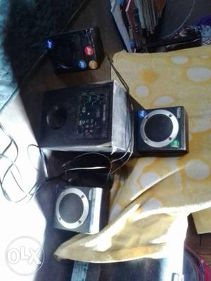 One woofer and three speakers in ok condition