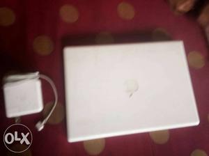 White MacBook With Power Adapter