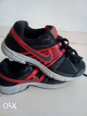 Pair Of Black-and-red Nike Running Shoes