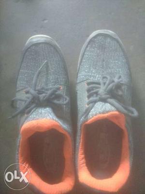 Pair Of Gray-and-orange Low Top Sneakers