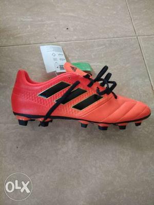 Pair Of Red Adidas Cleats