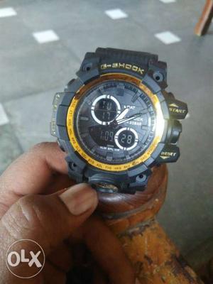 Round Black And Orange Casio G-Shock Digital Watch