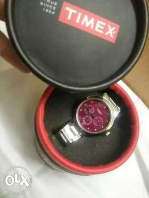 Round Pink And Silver-colored Timex Chronograph Watch With