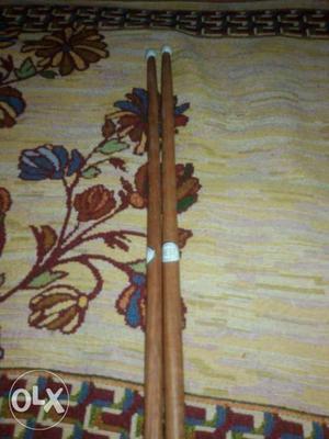 Two Brown Wooden Drum Sticks