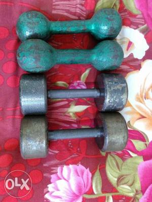 1 pair of 7 kg and 1 pair of 20 pounds dumbells