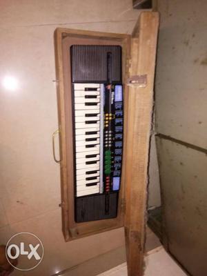 Casio piano with wooden box