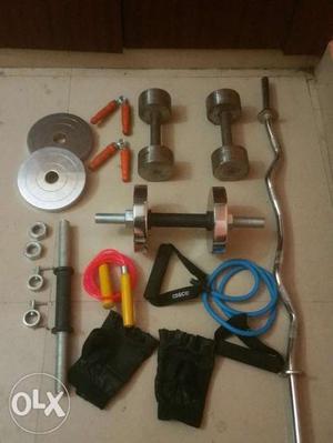 Dumbbell set includes high quality metal weights, rods,