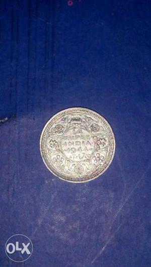 It's George VI King Emperor 1/4 rupee coin year of ..