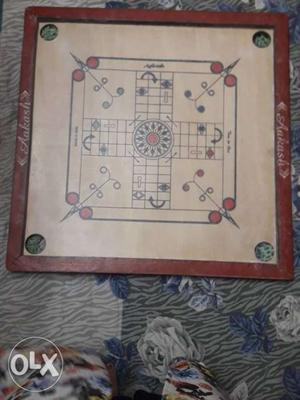 Red And Beige Carrom Board