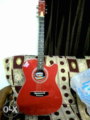 Red And Black Jumbo Cutaway Acoustic Guitar