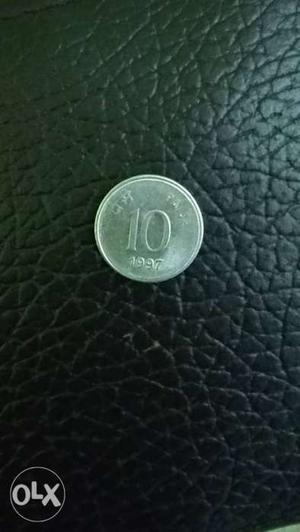 Round  Silver-colored 10 Indian Paise Coin