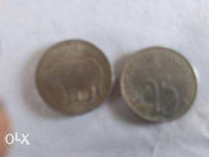 Two Round Silver-colored 25 Indian Paise Coin