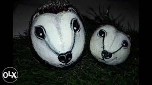 Two White And Black Animal Masks