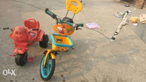 Two Toddler's Red And Yellow Trikes