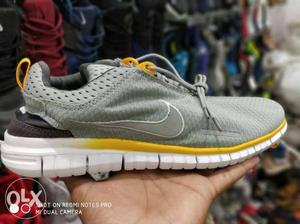 Gray And Yellow Nike Running Shoe