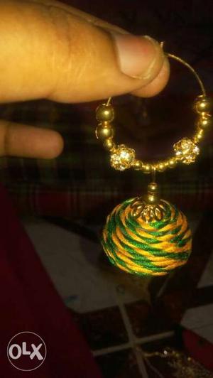 Green and yellow silk thread earring