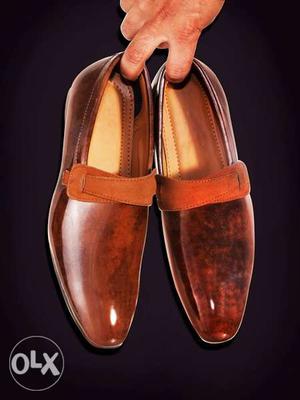 Pair Of Brown Patent Leather Loafer Shoes