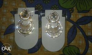 Pair Of Silver-colored Gemstone Encrusted Earrings