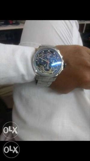 Round Blue And Silver-colored Chronograph Watch With