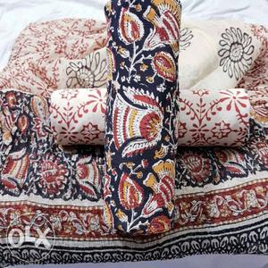 White, Red, And Black Floral Textile
