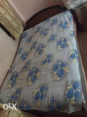 6/4 feet Wooden bed In good condition With its cotton gadda