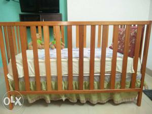 Baby cot with 4 inch thick mattress.