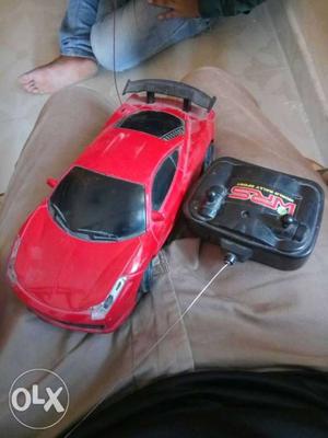 Red RC Sports Car With Black Remote