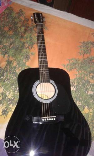Black Accoustic Guitar with bag.totally unused.bought