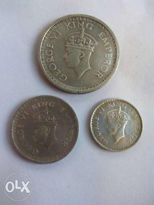 Three Round Silver-colored George King Emperor Coins