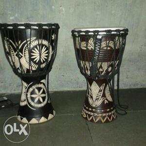 Two Brown And Black Djembe Drums