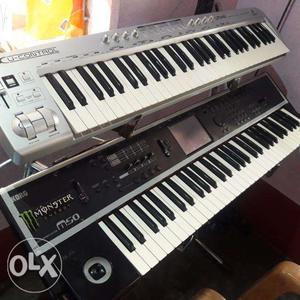 Two Gray And Black Electronic Keyboards