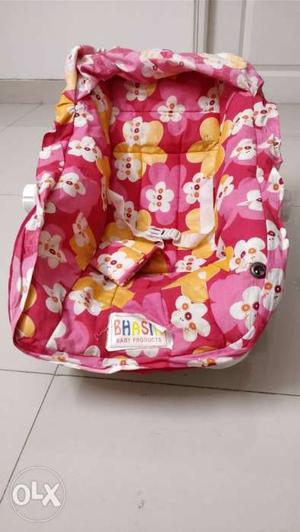 Baby's Yellow, Pink, And Red Floral Car Seat Carrier