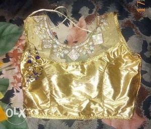 Designer golden blouse with hangings.