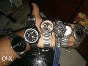 Four Round Silver Chronograph Watches