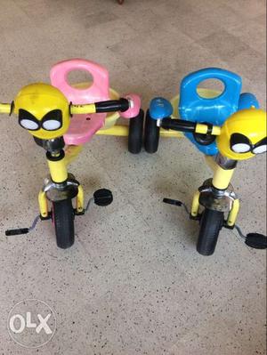 Toddler's Two Yellow-and-black Pedal Trikes