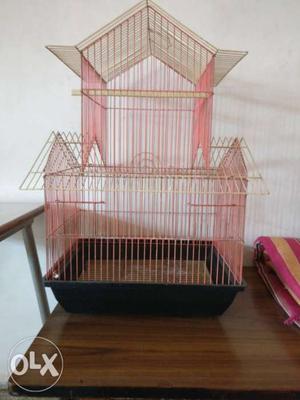 Bird cage in good shape, foldable,with storage for food and