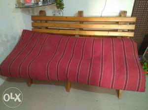 Brown Wooden Plank Framed Red Padded Sofa