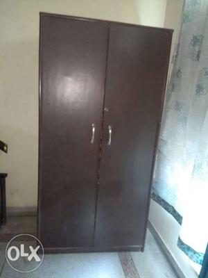 Dark brown colour cupboard with good space and