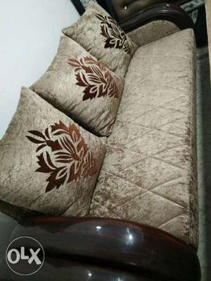 Silver Couch With Brown Wooden Frame