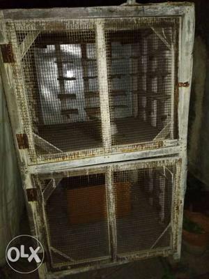 Two Brown Wooden Pet Cages