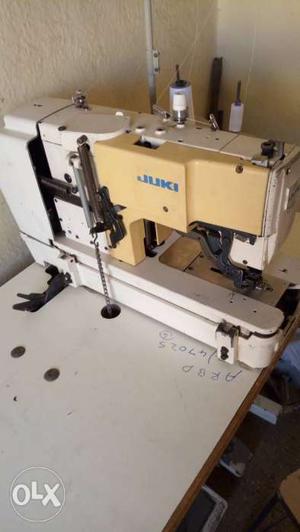 White And Gray Juki Overlock Sewing Machine