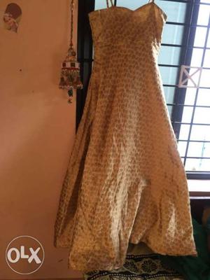 A beautiful golden gown with green shrug only